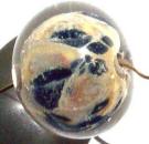 handmade glass lampwork bead, 
					organic silvered ivory with navy frit, encased